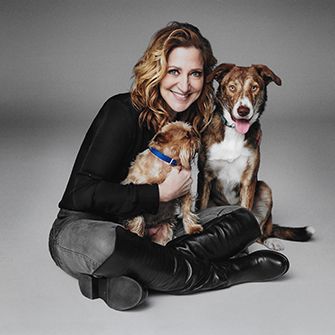 Edie Falco with two dogs